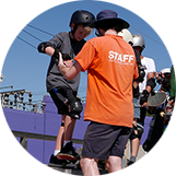 Junction Skate & BMX Park Staff helping group of children